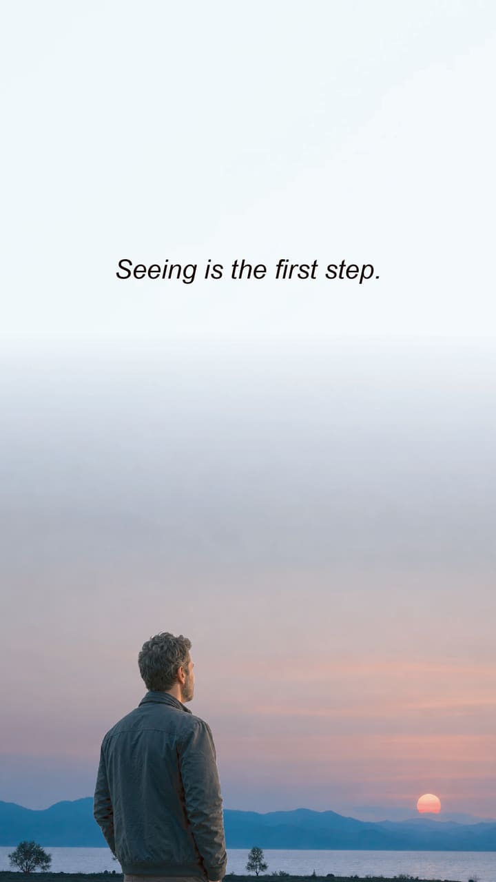 A man watching the sun set over a lake. The words: Seeing is the first step.